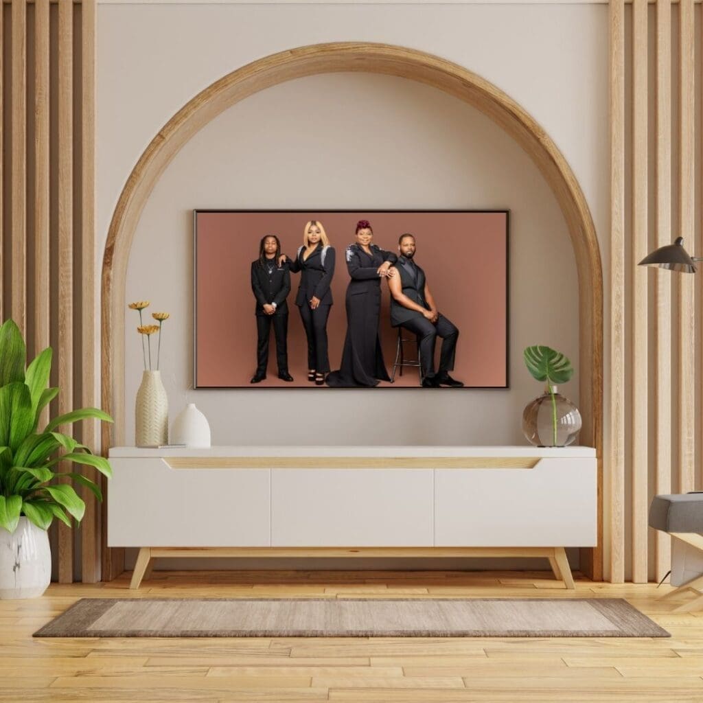 Family wall gallery in New Orleans home with framed portraits